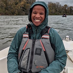 Chanda Littles in a lifejacket on a boat