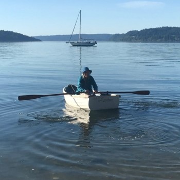 Person rowing a dinghy