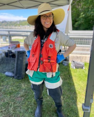 woman in hip waders and life jacket
