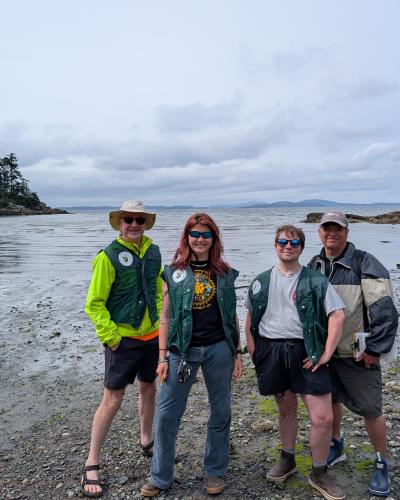 Whatcom MRC member Alex Alexander, summer interns Claire Glaude and Ferdinand Mesmer, and MRC member Mike McKay at the Wildcat Cove boat launch. (Dana Daniels).